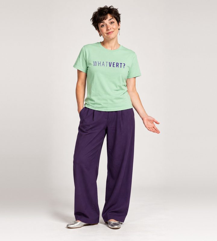 A woman in a mint WHATVERT? tee